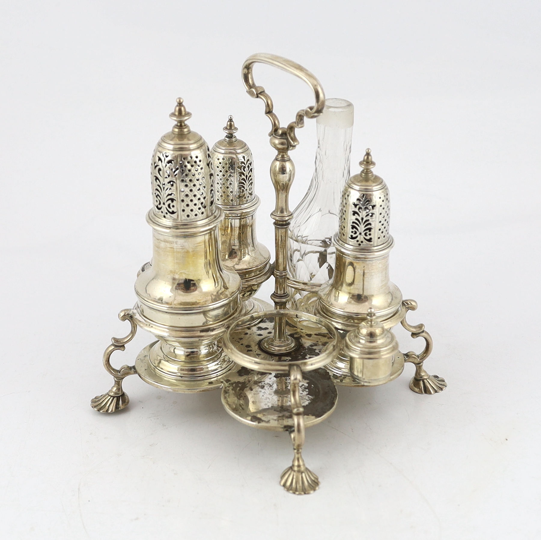 A George II silver cruet stand, with three matching graduated casters, by Samuel Wood
